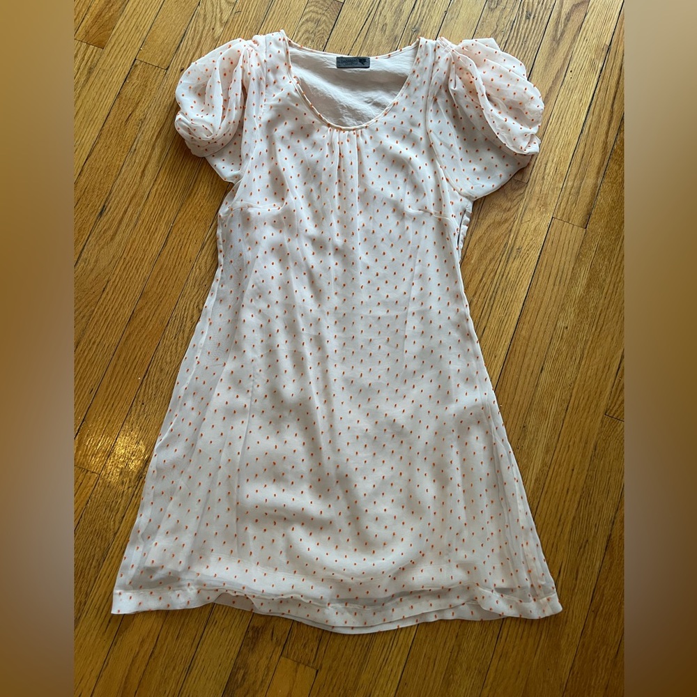 Cream dress with orange poms by Numph.